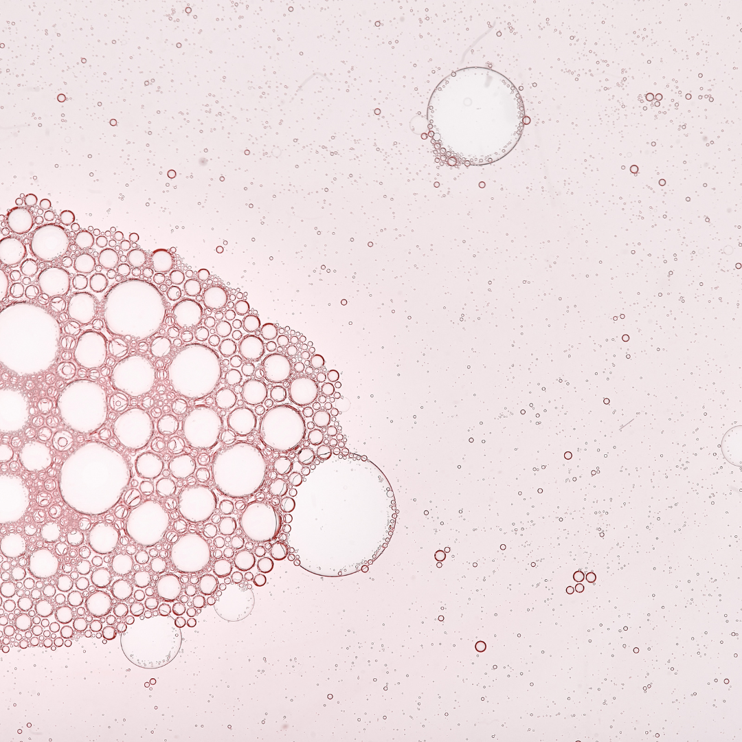 Pink bubbles on a light pink background