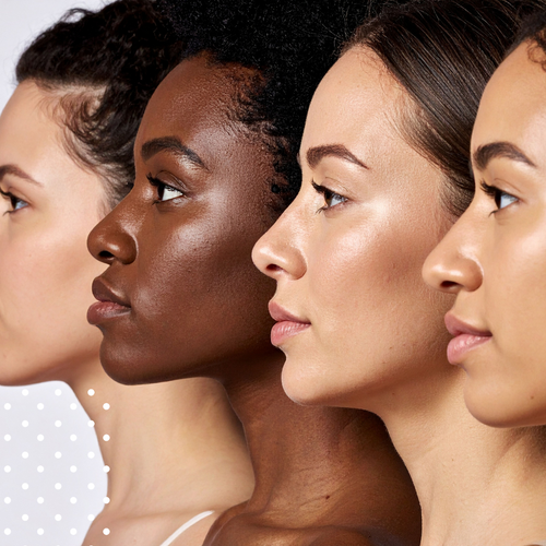 Four women of different skin tones with a neutral background